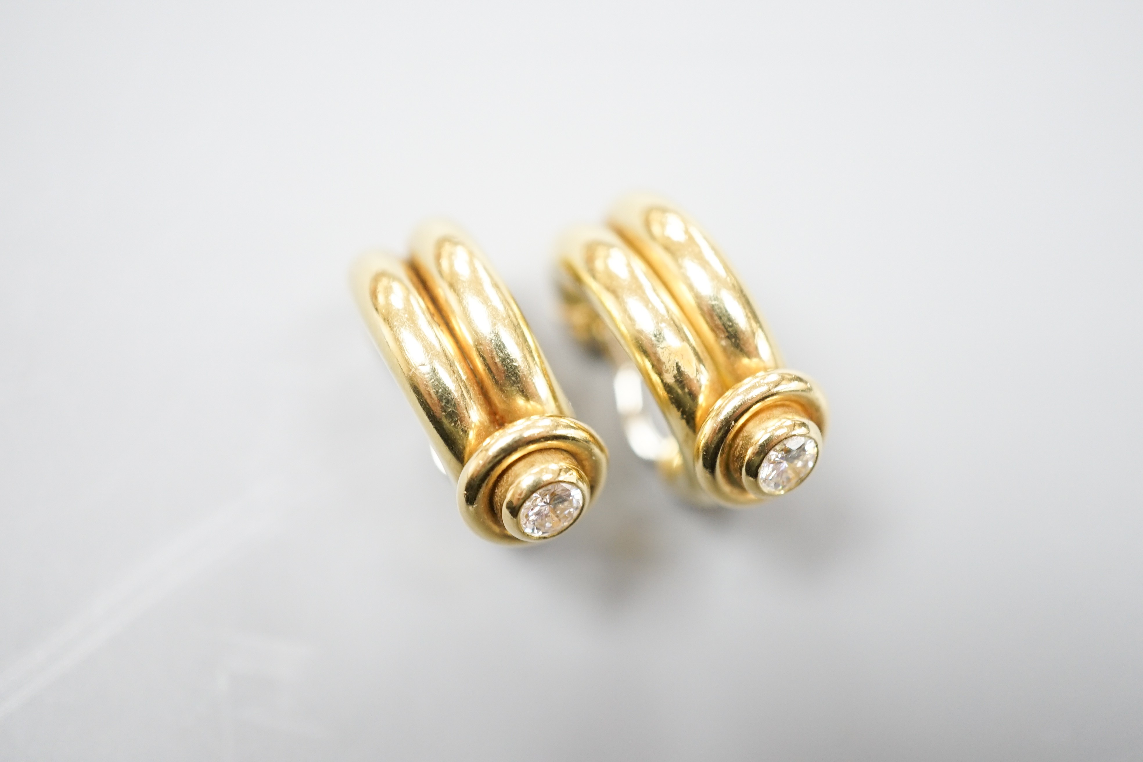 A pair of 20th century Italian 750 yellow metal and diamond set hoop ear clips, 22mm